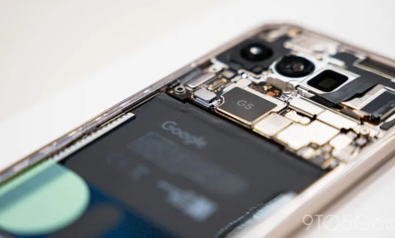 Close-up of a Google Pixel phone with its back removed, exposing internal components.