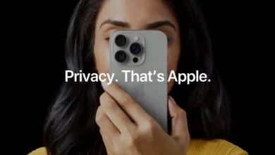 Person holding iPhone 13 Pro covering face, text reads 'Privacy. That's Apple.'