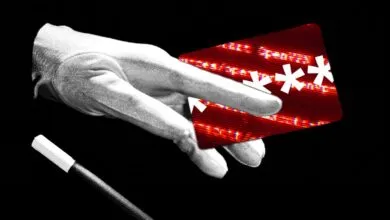 Gloved hand holding a distorted credit card with asterisks, magic wand nearby.