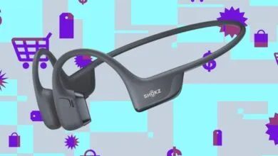 Gray Shokz OpenRun Pro bone conduction headphones on a colorful background.