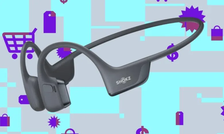 Gray Shokz OpenRun Pro bone conduction headphones on a colorful background.