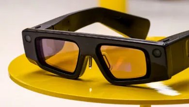 Snapchat Spectacles on a yellow table, showcasing the camera and lens.