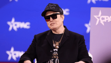 Elon Musk wearing a 'Make America Great Again' hat and sunglasses.