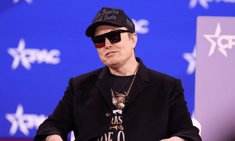 Elon Musk wearing a 'Make America Great Again' hat and sunglasses.