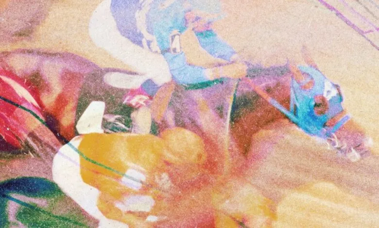 Abstract, grainy image of a horse race with jockeys in colorful attire.
