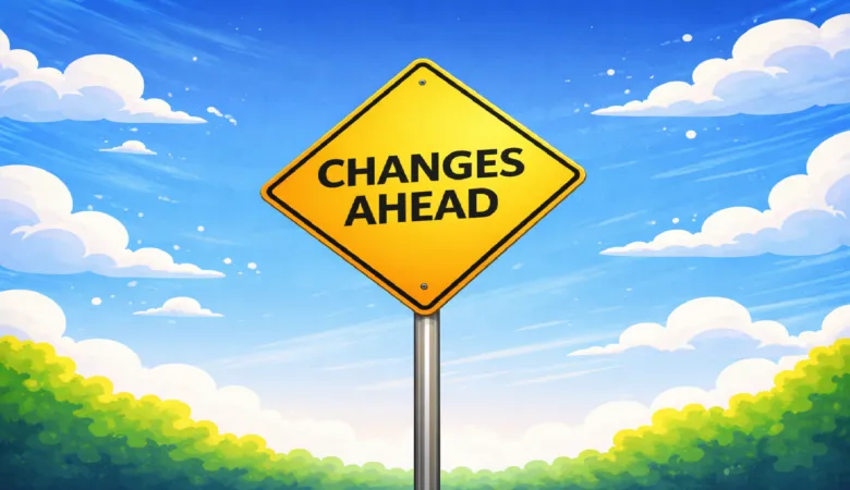 Yellow diamond 'Changes Ahead' sign against a blue sky with fluffy clouds.