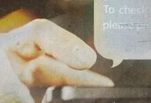 Close-up of a hand interacting with a digital interface.