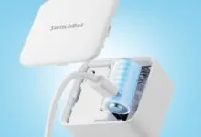 SwitchBot rechargeable battery pack being charged with USB cable.