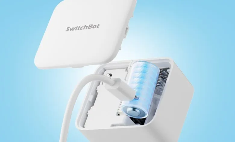 SwitchBot rechargeable battery pack being charged with USB cable.