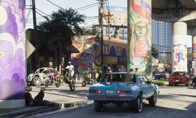 Street scene with colorful murals, cars, and people on motorcycles.