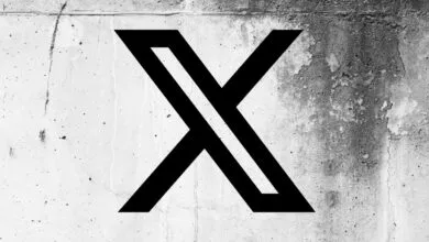 Black X logo on a textured concrete wall background.