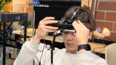 Person wearing a device on their head, possibly for research or medical purposes.