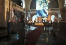 Grand hall with people, statues, and a '25th Anniversary Gala' banner.