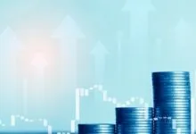 Stacks of coins increasing in height, overlaid with upward-pointing arrows and a financial chart.