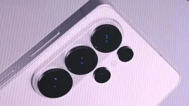 Close-up of a smartphone's camera array with multiple lenses.