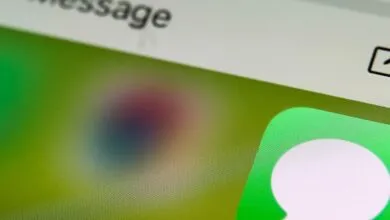 Close-up of an iPhone screen displaying the Messages app icon.