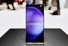 Samsung Galaxy S23 Ultra phone on display with purple screen.