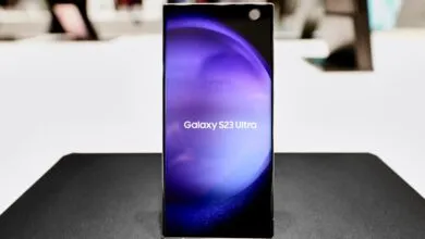 Samsung Galaxy S23 Ultra phone on display with purple screen.
