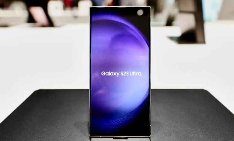 Samsung Galaxy S23 Ultra phone on display with purple screen.