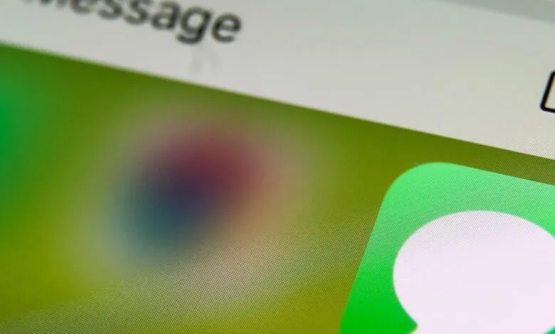 Close-up of an iPhone screen displaying the Messages app icon.