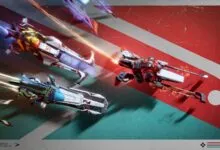 Three futuristic racing vehicles speed across a red and green track.