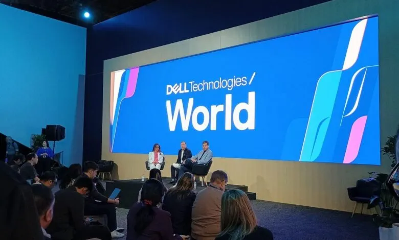 Dell Technologies World event with speakers on stage and audience.
