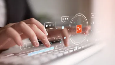 Hands typing on keyboard with digital search and chat icons.