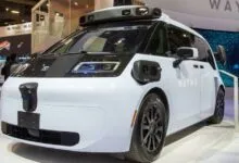 Waymo self-driving vehicle on display at an exhibition.
