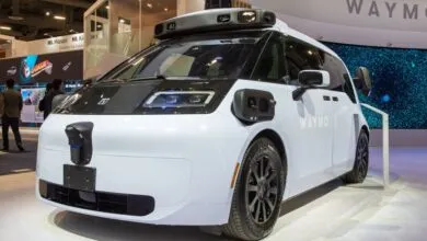 Waymo self-driving vehicle on display at an exhibition.