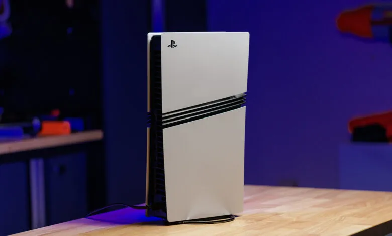 PlayStation 5 console standing vertically on a wooden surface.