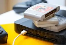 Analogue 3D console with N64 game cartridges and controller.