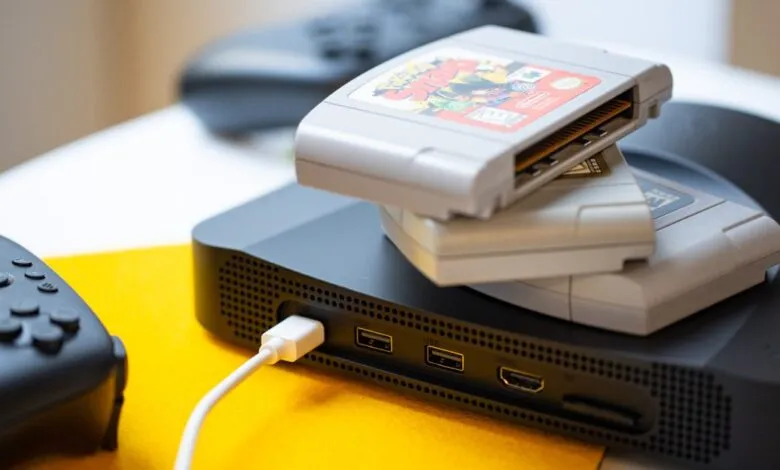 Analogue 3D console with N64 game cartridges and controller.