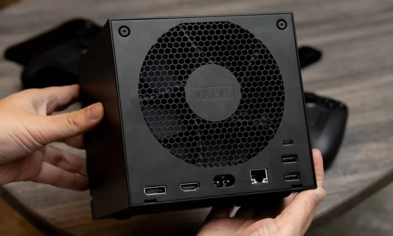 Valve PC gaming console held, showing ports and fan grill.