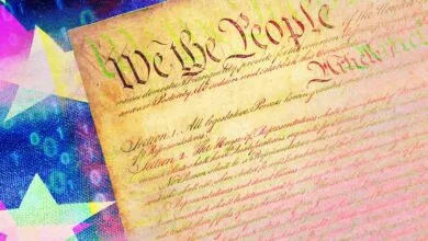 Close-up of the US Constitution with digital overlay of stars and binary code.