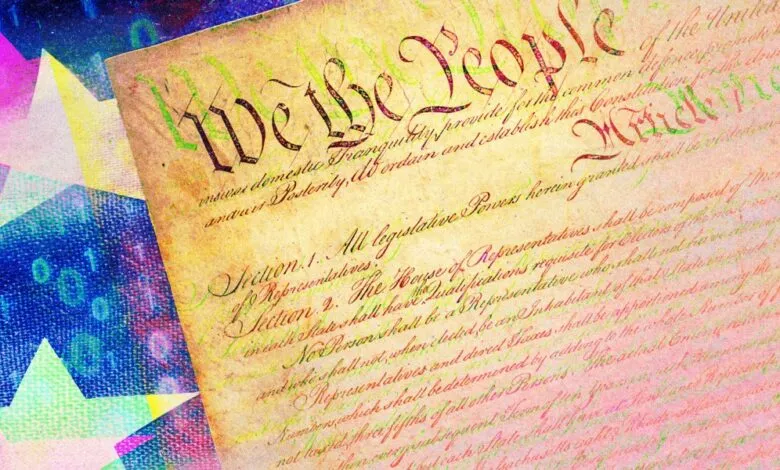 Close-up of the US Constitution with digital overlay of stars and binary code.