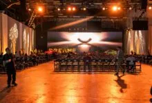 Event space with rows of chairs facing a stage with 'DREAME NEXT' displayed.