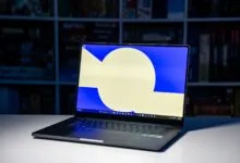 Open Samsung laptop on a white surface with a blue and white screen.