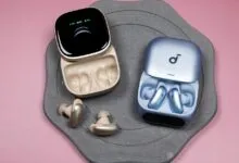 Soundcore Liberty 5 Pro earbuds in open charging cases, gold and blue.