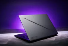 Asus ROG Zephyrus G14 laptop with a sleek gray design and purple backlight.