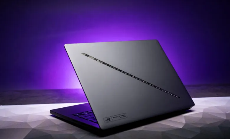 Asus ROG Zephyrus G14 laptop with a sleek gray design and purple backlight.