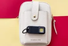 Pebblebee Halo tracker attached to a Bandolier crossbody bag.