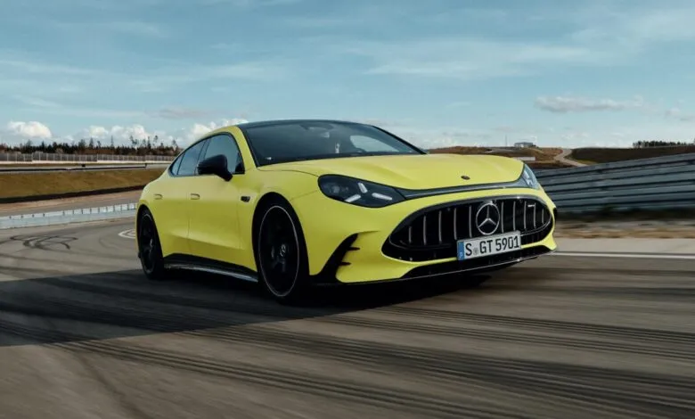 Yellow Mercedes-AMG GT 63 4-Door Coupé driving on a racetrack.