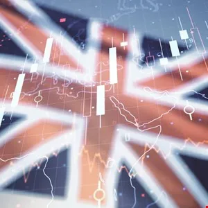 Candlestick chart overlayed on a blurred Union Jack flag, representing UK market analysis.