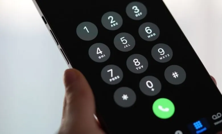 Close-up of a smartphone's dial pad with a green call button.