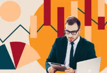 Man in suit with tablet and laptop against abstract data graphics.