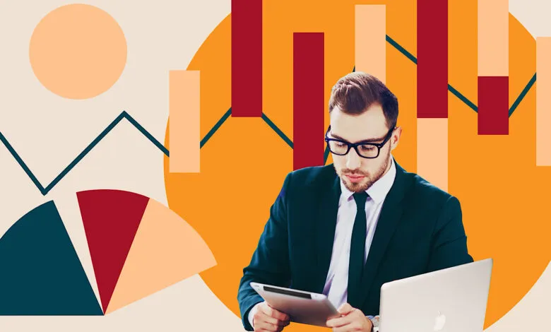 Man in suit with tablet and laptop against abstract data graphics.