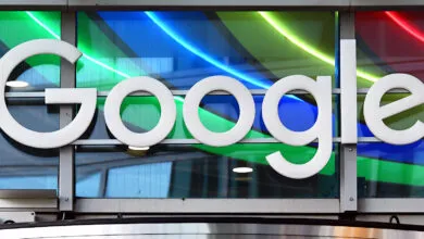 Google logo displayed against a colorful, modern glass facade.
