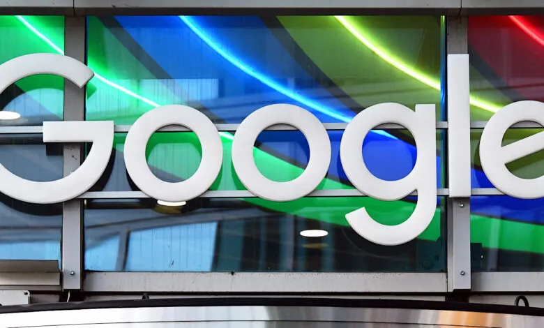 Google logo displayed against a colorful, modern glass facade.