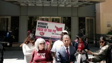 Group of people protesting for a $30 living wage in Alameda County.