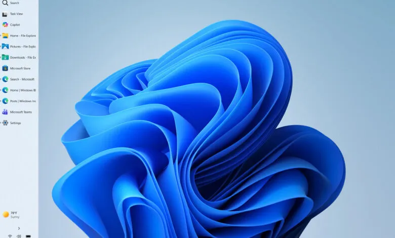 Windows 11 desktop with blue abstract wallpaper and left-side menu.